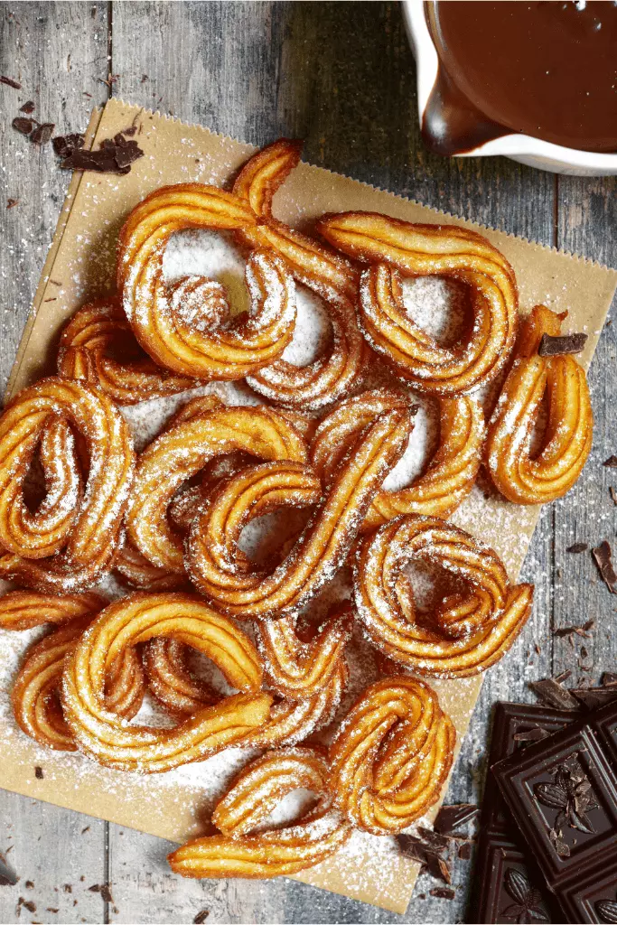 Traditional mexican dessert churros with chocolate sause
